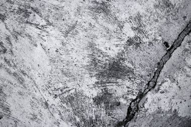 Eski grunge kirli desenli beton duvar yüzeyi. Düz olmayan lekeler ve küçük deliklerle.