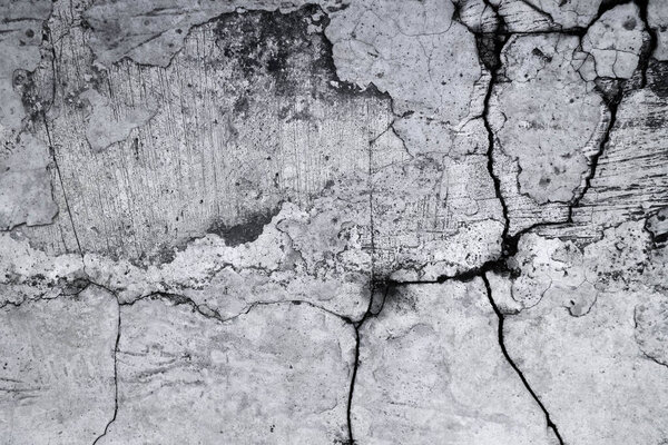 Старая грязная текстурированная поверхность цементной стены. С неровными пятнами и крошечными отверстиями.