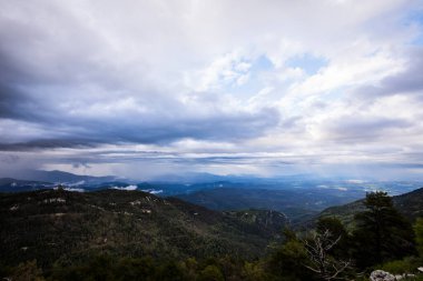 Spring sunset in Santuari Mare De Deu Del Mont peak, La Garrotxa, Spain.