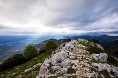 Spring sunset in Santuari Mare De Deu Del Mont peak, La Garrotxa, Spain.