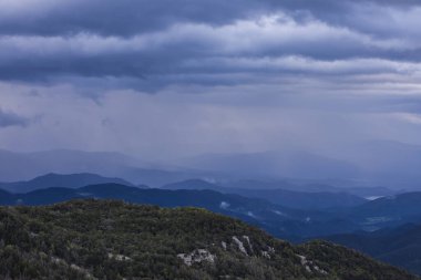 Spring sunset in Santuari Mare De Deu Del Mont peak, La Garrotxa, Spain.