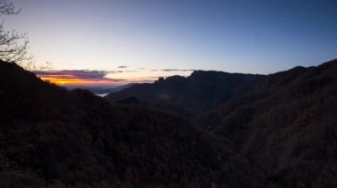 Time lapse scene of autumn sunrise in Puigsacalm peak, La Garrotxa, Spain