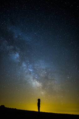 Milky way and girl in Serra Del Montsec, Lleida, Spain.