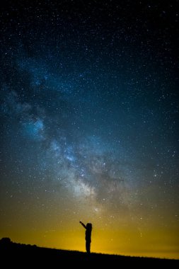 Milky way and girl in Serra Del Montsec, Lleida, Spain.