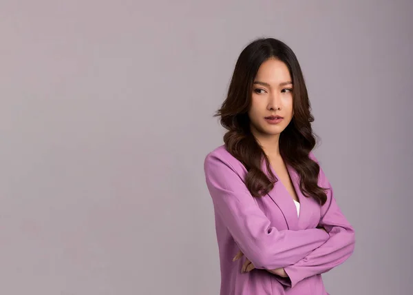 Asian Woman Long Hair Wearing Pink Suit Standing Arms Crossed — 스톡 사진