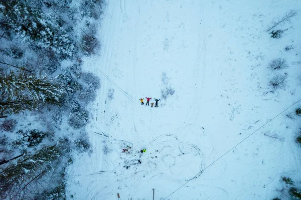 Aerial view of people doing angels on the snow