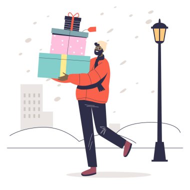 İnsan kış tatili ve yeni yıl kutlaması için bir yığın Noel hediyesi taşır.