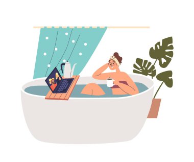 Genç kız sıcak çay ya da kakao içerek banyo yapıyor.