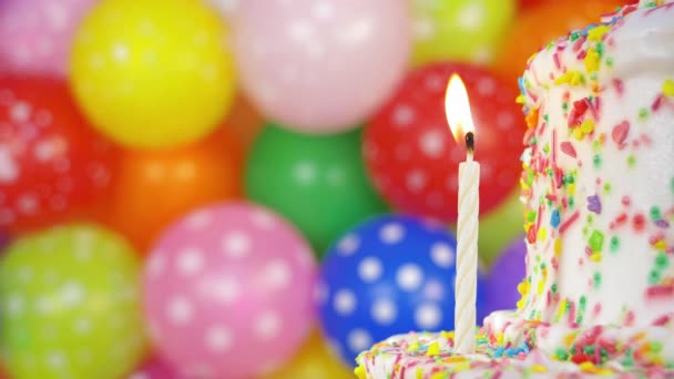 Happy Birthday Candle Varicolored Balloons Blowing Out One Candle Cake — Stock Video