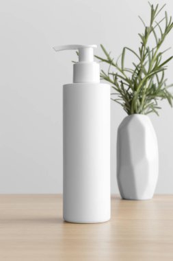White cosmetic shampoo dispenser bottle mockup with a rosemary on the wooden table.