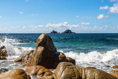 Looking out towards The Brisons from Porth Nanven beach, on the west of Cornwall