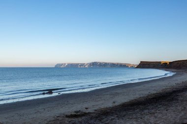 An early morning view looking over the sea towards Freshwater Bay, on the Isle of Wight
