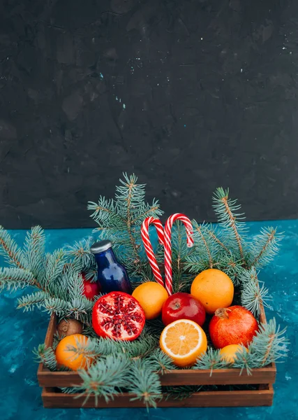 Christmas Composition Wooden Basket Fruits Lollipops Christmas Tree Blue Background — Stock Photo, Image