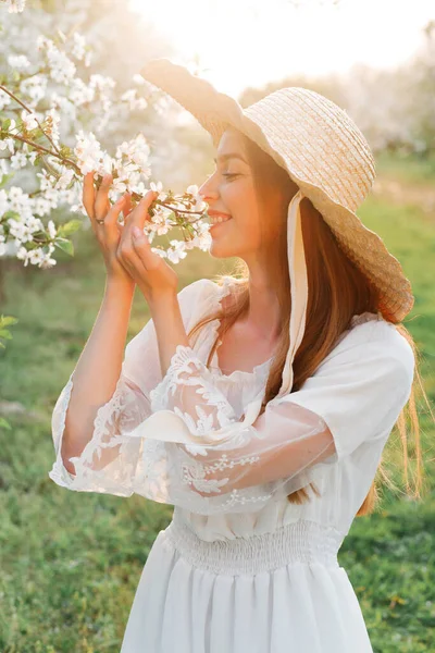 Woman Straw Hat Sniffs Flowering Apple Tree Branch — Stock Photo, Image
