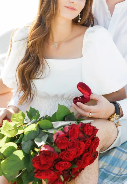 Proposal on a sandy beach. The woman said yes.