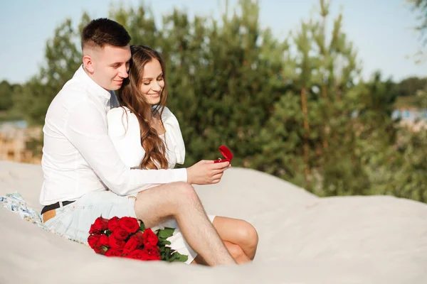 He proposed, and she said yes, against the backdrop of a beautiful sunset