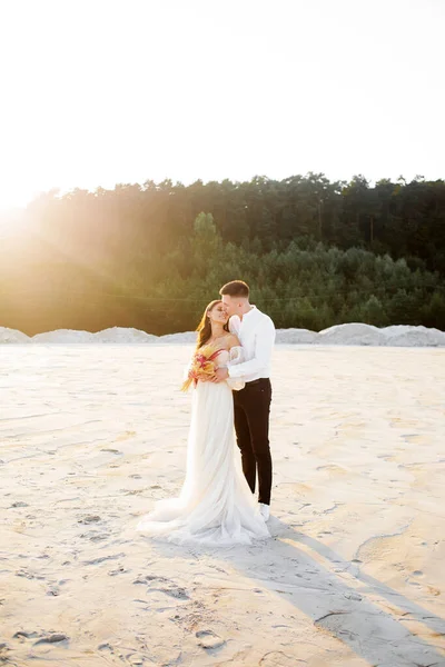 Young Couple Kissing Sand Quarry Wedding Day — Stock fotografie