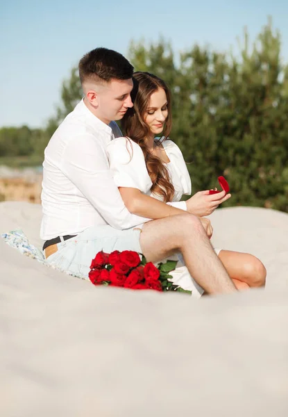 He proposed, and she said yes, against the backdrop of a beautiful sunset