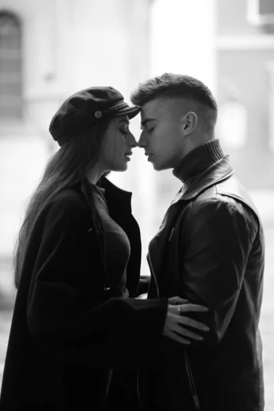 Sweet couple boy and girl hugging in the yard. Concept of love, romance and passion.