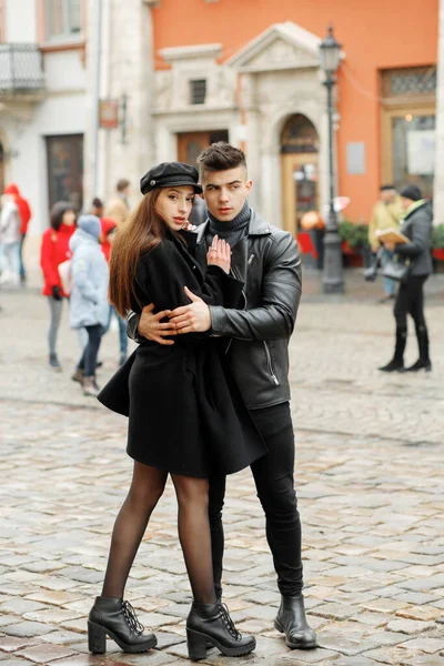 Luxury couple boy and girl hugging on the street.