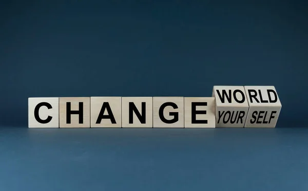 Change the world or yourself concept. The cubes form the words change the world to change yourself. Business concept of changing yourself.