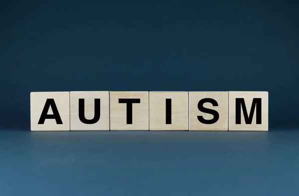 Autism. Cubes form the word Autism. Concept of Autism - a disease of the nervous system in medicine