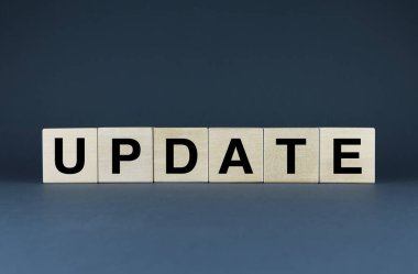 Update. Cubes form the word Update. The broad concept of the word Update ranging from software to wardrobe