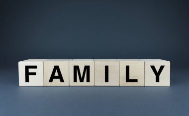 Family. Cubes form the word Family. The concept of the word Family
