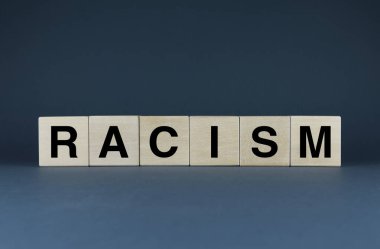 Racism. Cubes form the word Racism. Racism word concept - discrimination people, social problems