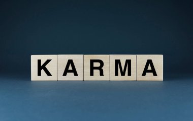Karma. Cubes form the word Karma. Concept of word Karma