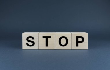 Stop. Cubes form the word Stop. The extensive concept of the word Stop used in different areas