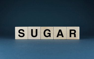 Sugar. Cubes form the word Sugar. Sugar word concept - food