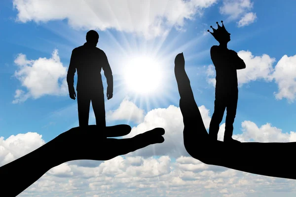 Selfishness and arrogance. A distressed man on a begging hand and an arrogant man with a crown standing on the stop hand. Concept of selfishness and lack of compromise. Silhouette