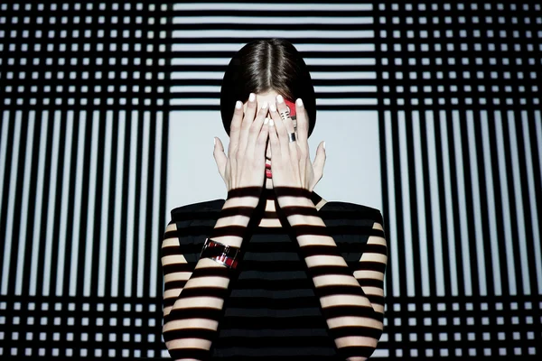 Fashion girl closing her face — Stock Photo, Image