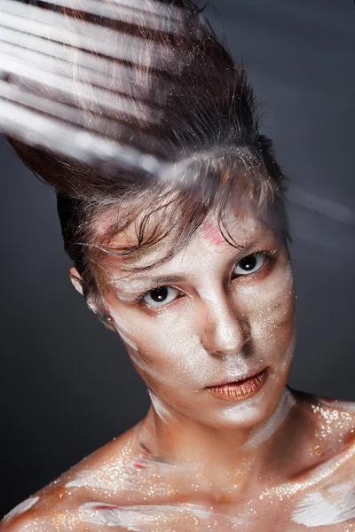 Girl in paint covered with shimmering sequin — Stock Photo, Image