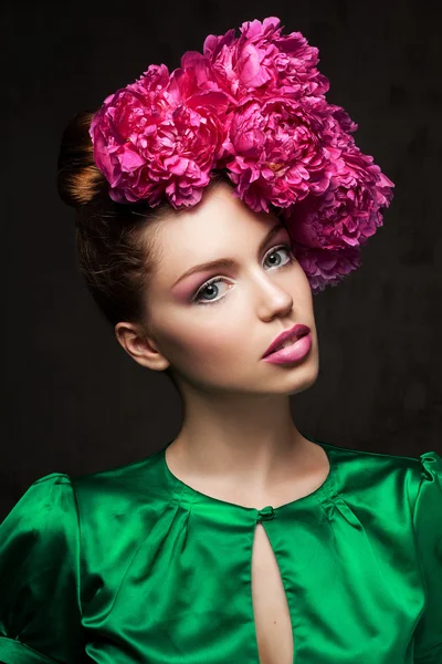 Woman with peonies — Stock Photo, Image