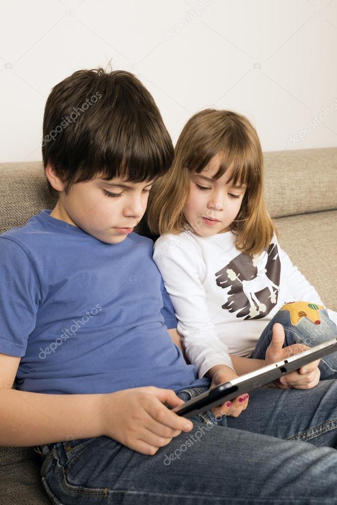 Children playing with a digital tablet