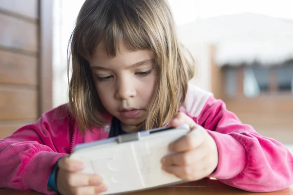 Little girl with a smartphone — Stock Photo, Image