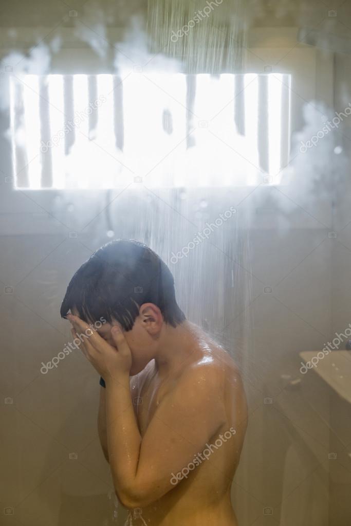 Young boy showering. 