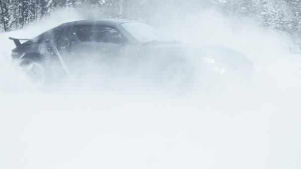 MOSCOW, RUSSIA - 13 DECEMBER 2020: A black sports car is drifting in the forest. Slow motion — Stockvideo