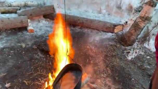 Man Hangs Second Kettle Frozen Water Fire Beautiful Blazing Fire — Vídeos de Stock