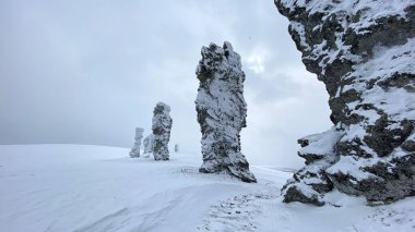 Giants of the Manpupuner Plateau. Weathering pillars in the Komi Republic, Russia. Geological monument in the Troitsko-Pechora region. One of the seven wonders of Russia.