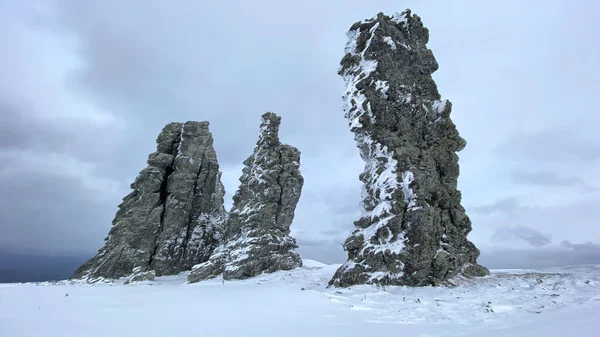 Weathering pillars. Geological monument in the Troitsko-Pechora region. Giants of the Manpupuner Plateau, Komi Republic, Russia. One of the seven wonders of Russia.