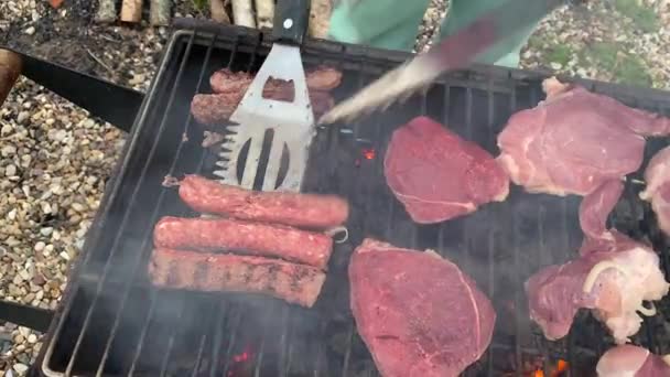 Cook Turns Fried Sausages Charcoal Grill Spatula Tongs Cooking Barbecue — Stock video