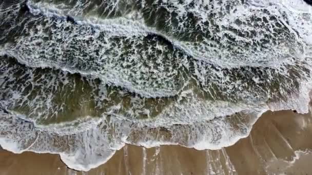 Aerial drone view flight over sea waves that roll onto sandy shore — Stock Video