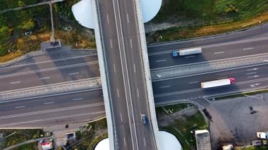 Aerial Drone View Flight Over road bridge, car junction with driving cars trucks