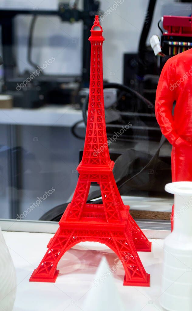 Red model printed on a 3D printer from plastic close-up