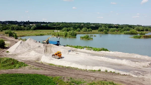 Aerial drone view flight over sand mining. Sand quarry. Top view.