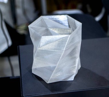 Object prototype printed on 3d printer from plastic filament close-up.