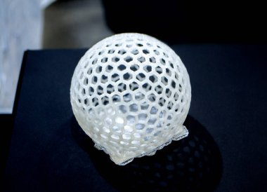 Object prototype printed on 3d printer from plastic filament close-up.
